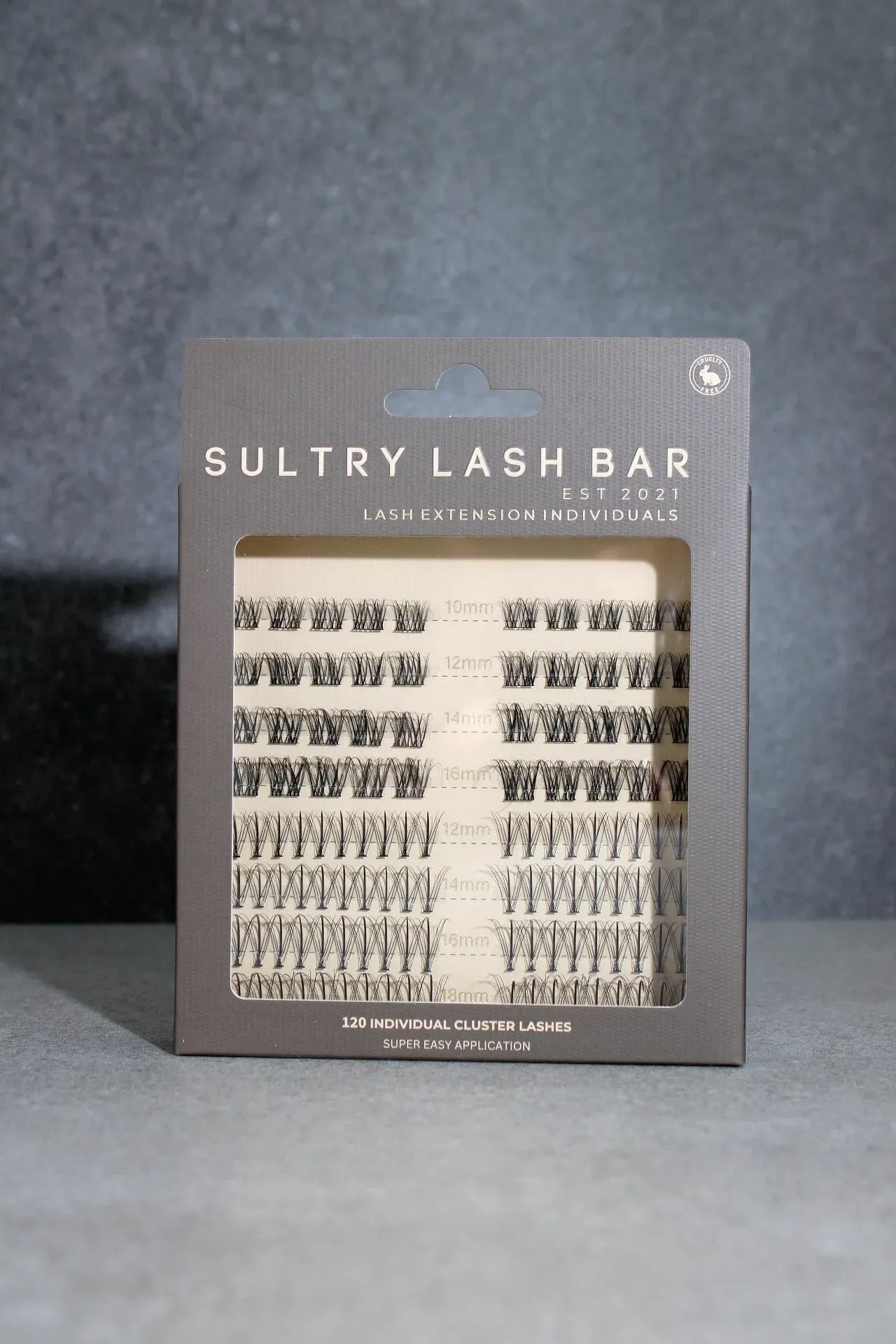 Sultry Lash Bar lash extension packaging on a gray background