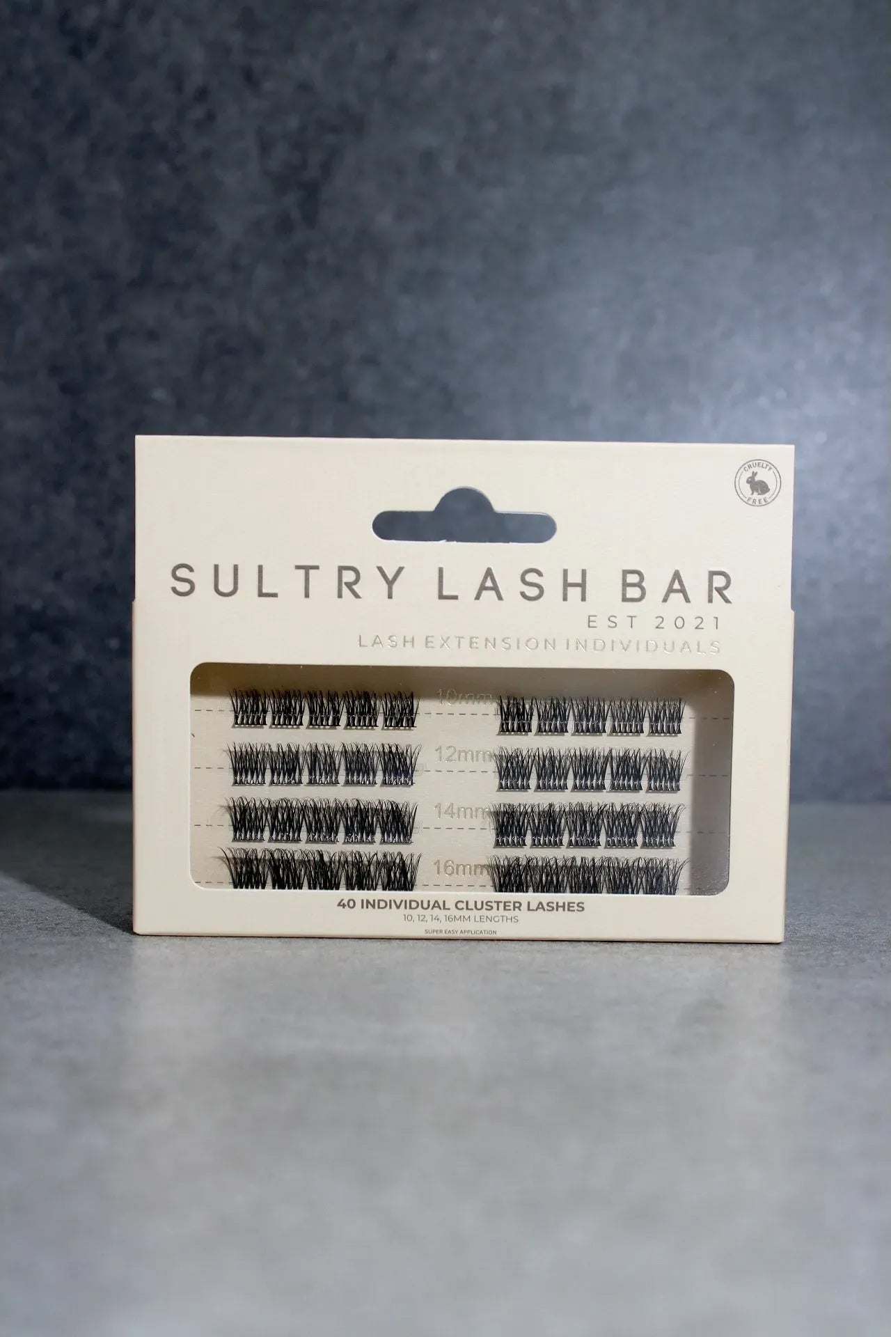 Sultry Lash Bar lash packaging on a gray background