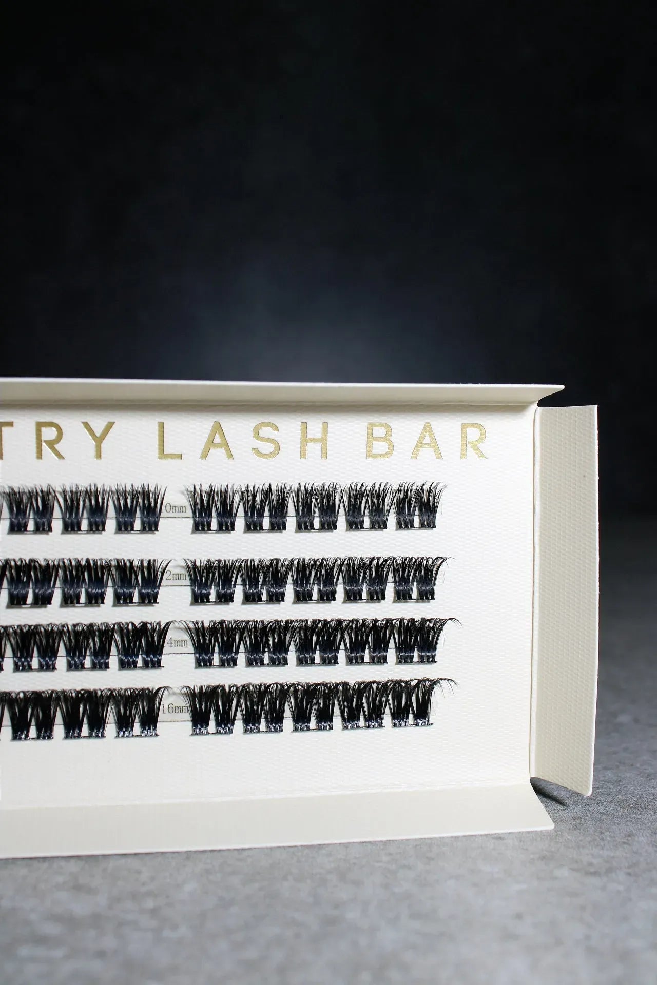Eyelash extension box from Try Lash Bar on a dark background