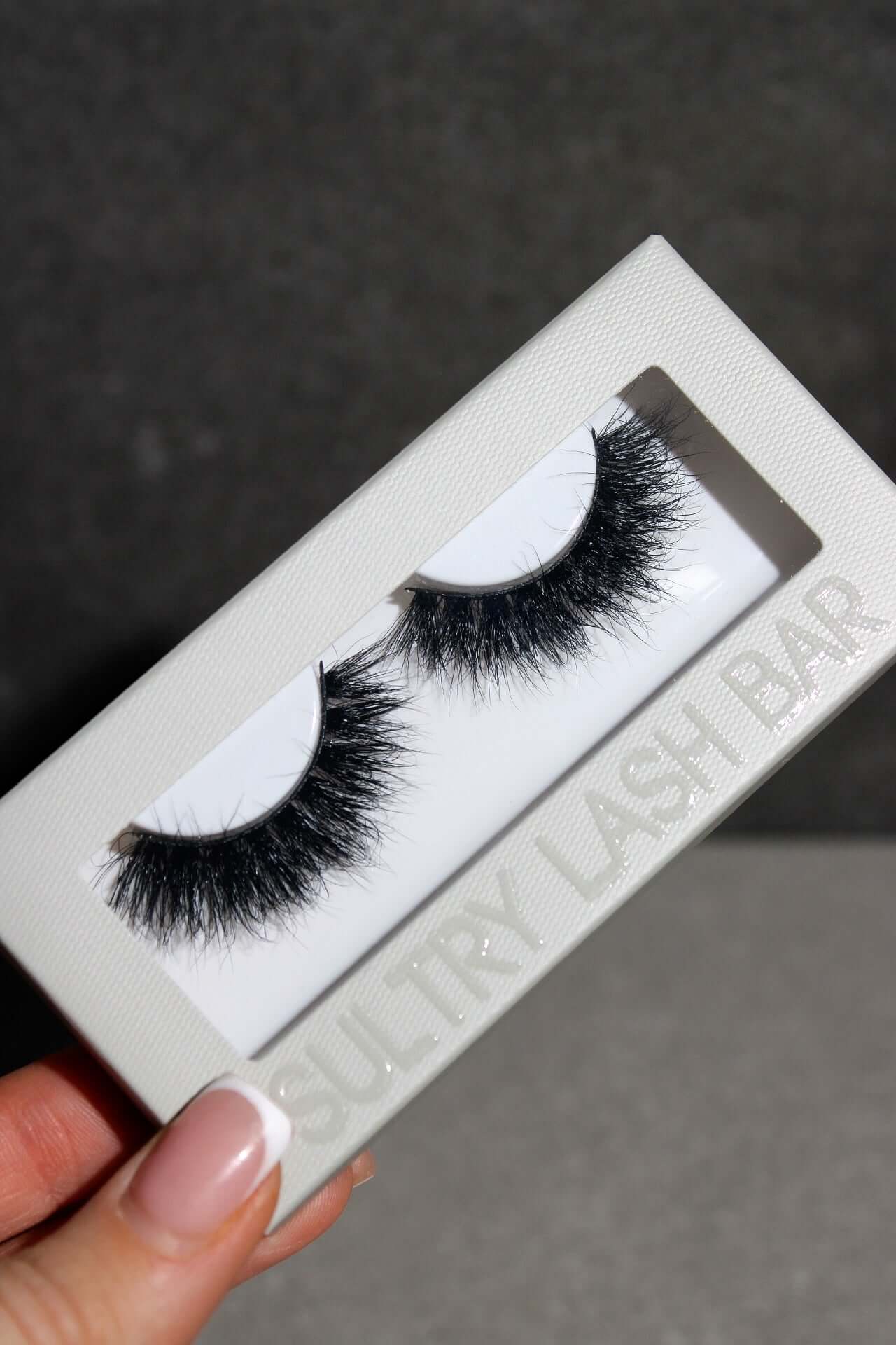 Healer Mega Volume Russian Strip Lashes on display in Sultry Lash Bar packaging, showcasing dramatic XXL curl and volume.