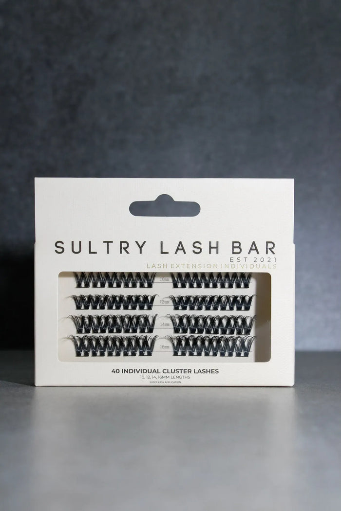 Packaging of Sultry Lash Bar false eyelashes on a dark background