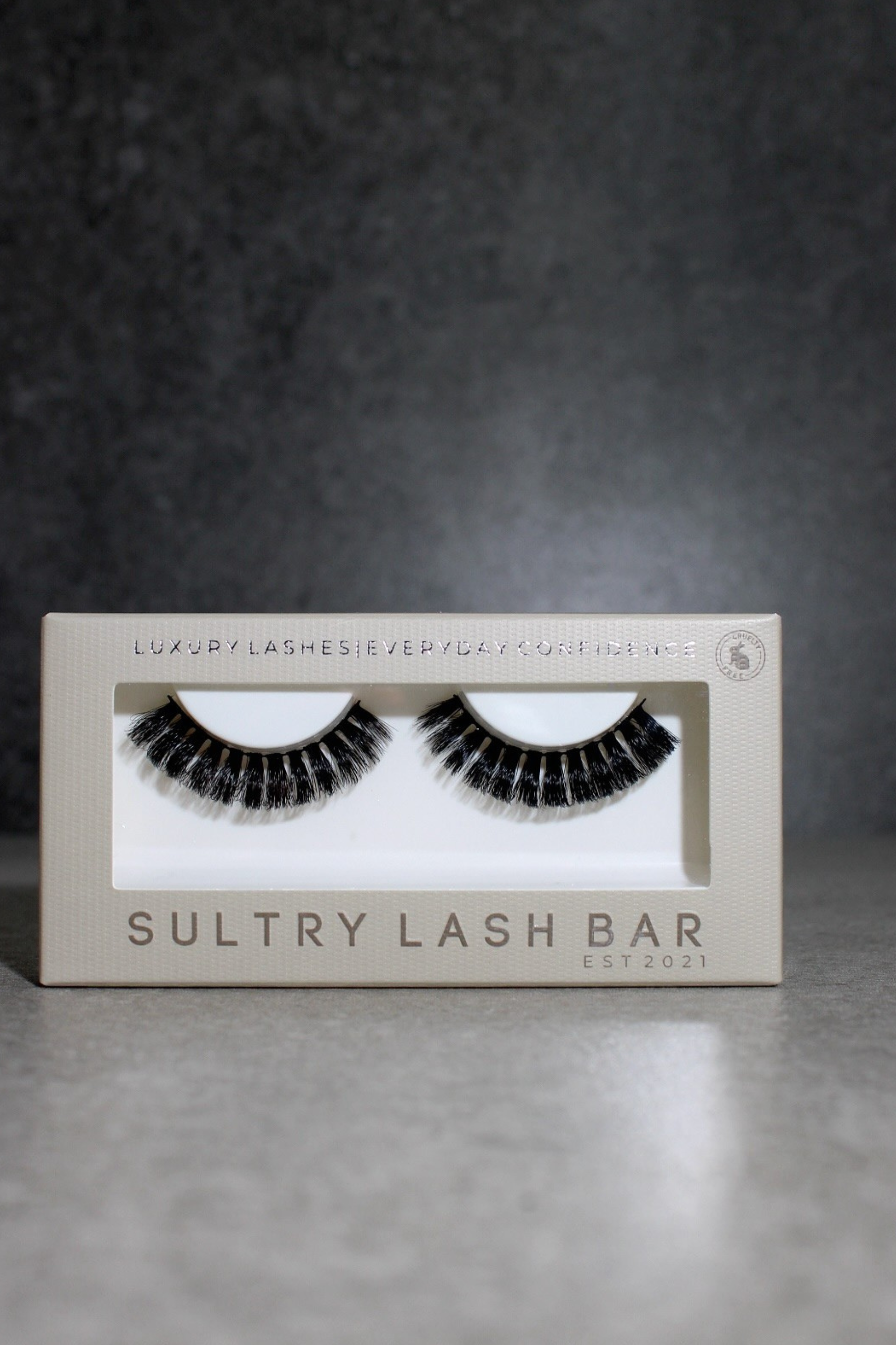 Sultry Lash Bar false eyelashes packaging on a gray background