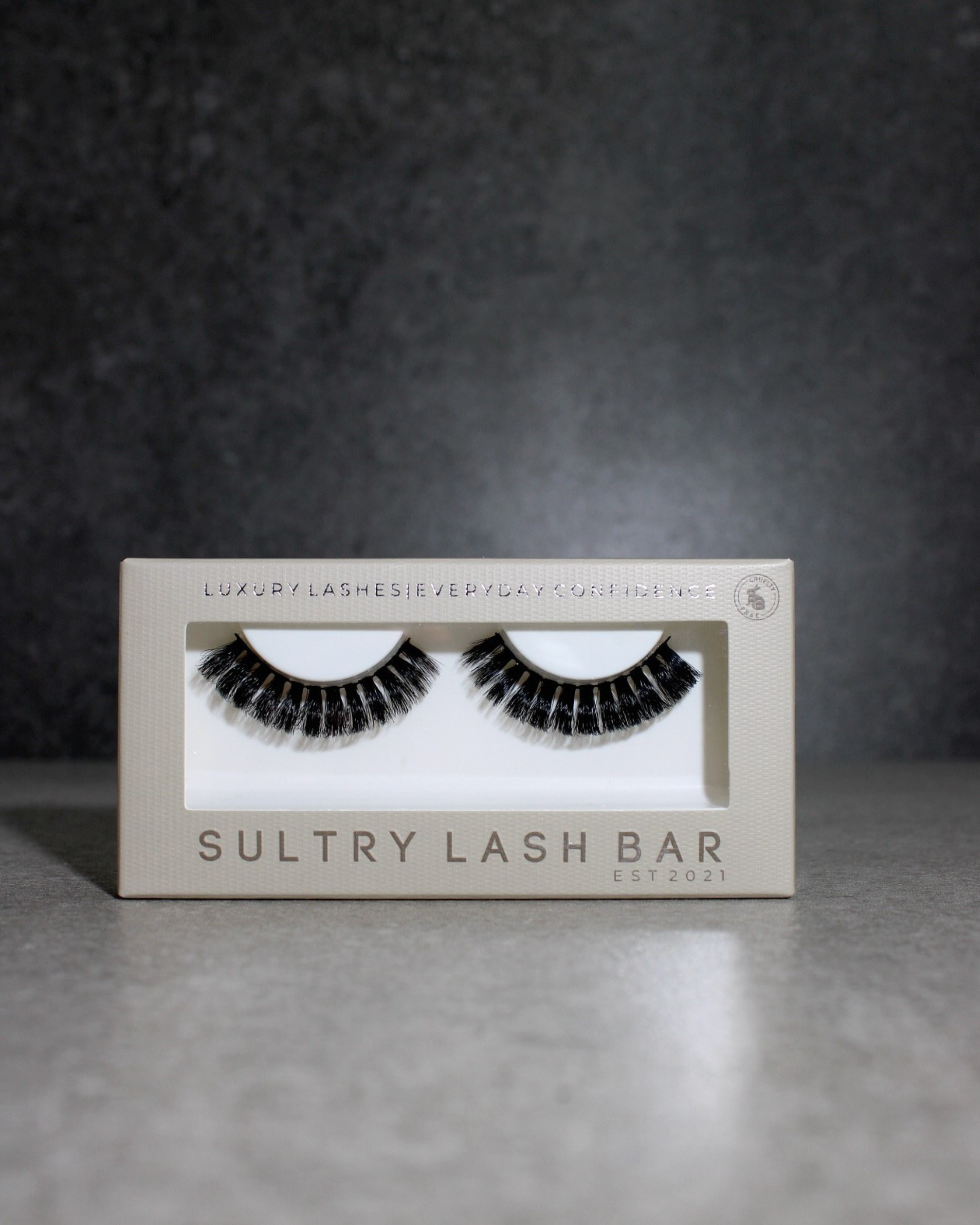Sultry Lash Bar false eyelashes packaging on a gray background
