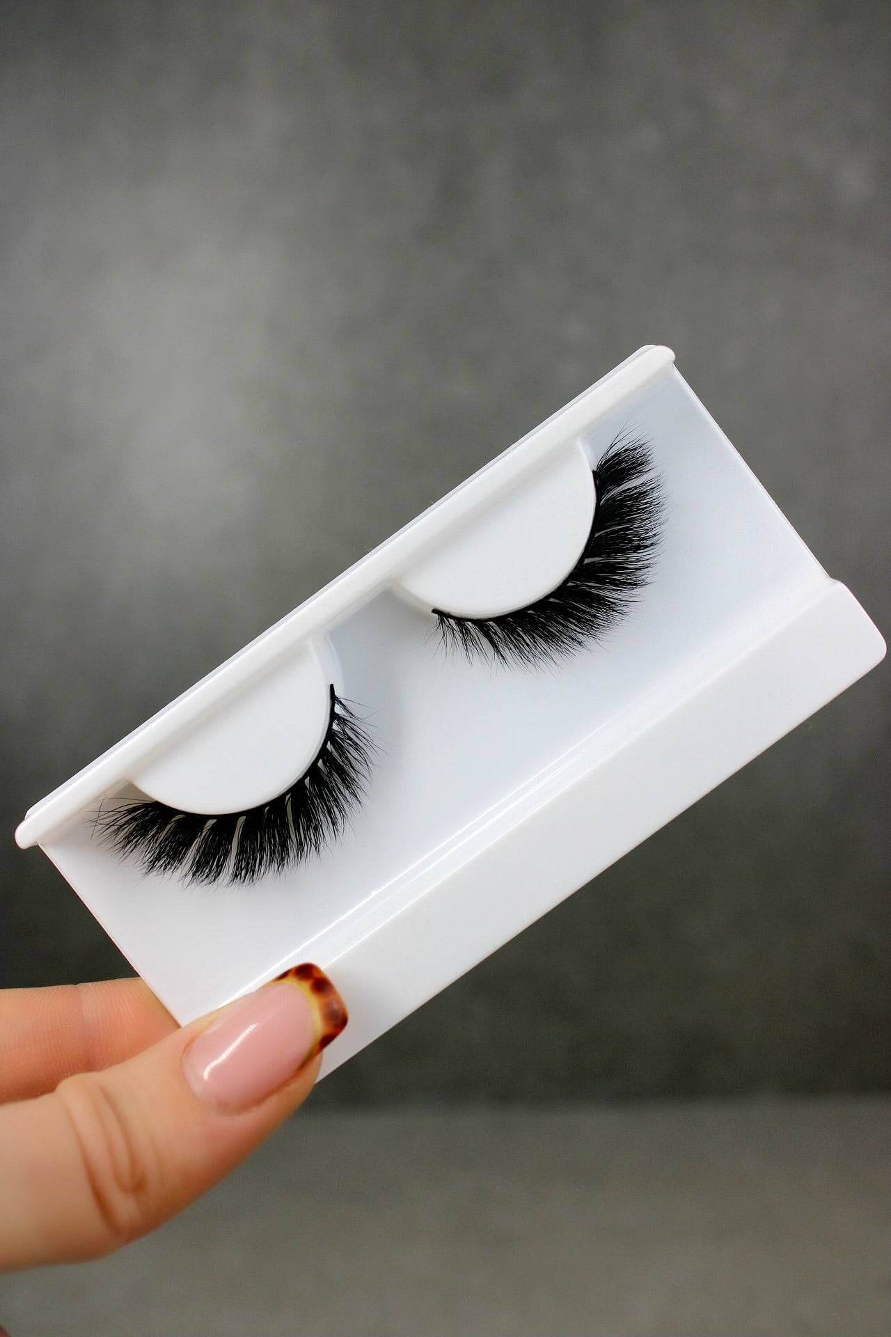 Cat Eye Winged Out Strip Lashes in a case, showcasing luxurious natural look eyelash extensions for a glamorous transformation.