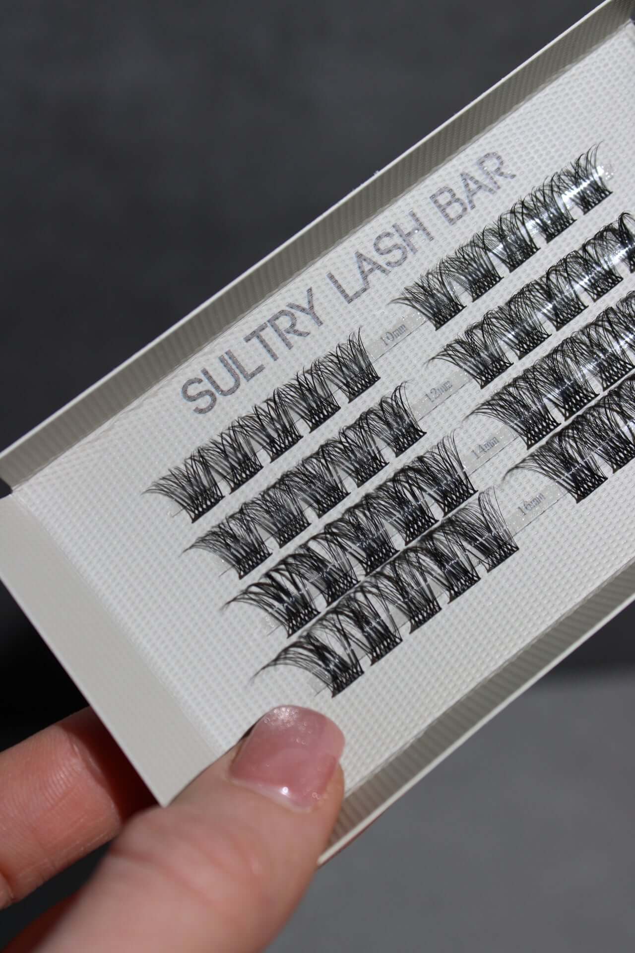 Image of Sultry Lash Bar DIY individual lash extensions in various lengths for a natural eyelash look.