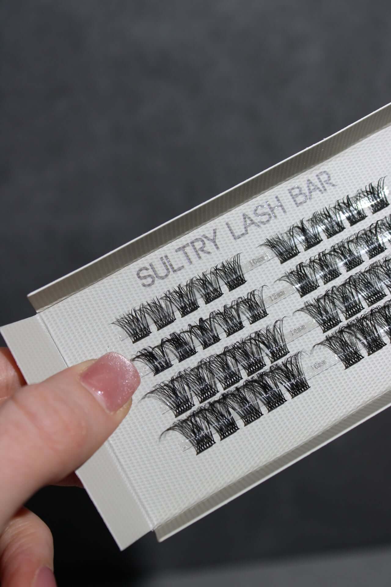 Individual lash extensions displayed from Sultry Lash Bar, perfect for achieving a natural look and enhancing eye makeup.
