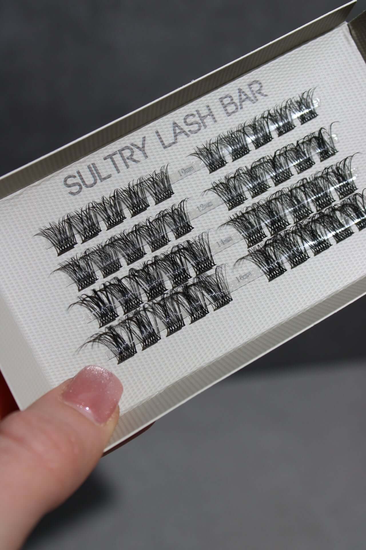 Close-up of Sultry Lash Bar individual lash extensions showcasing various natural styles for stunning eye looks.