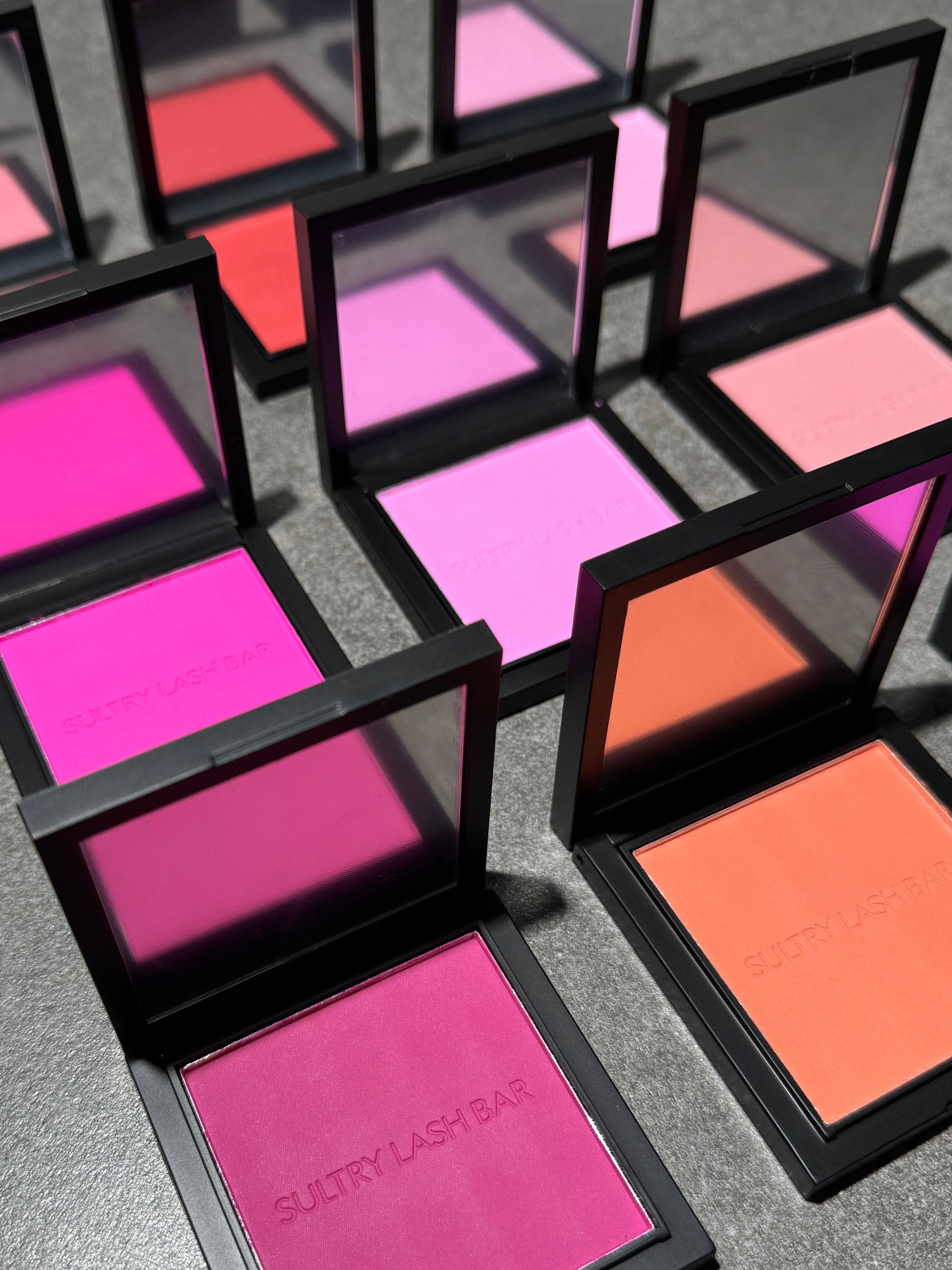 Angled view of Sultry Lash Bar powder blushes in bold and soft tones, highlighting cruelty-free, long-lasting makeup options.