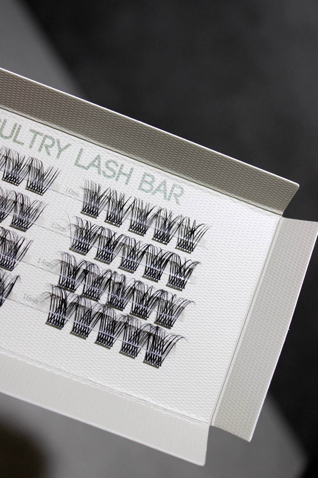 Close-up of SL03 Long Lasting DIY individual eyelash extensions in a display tray for natural lash looks.