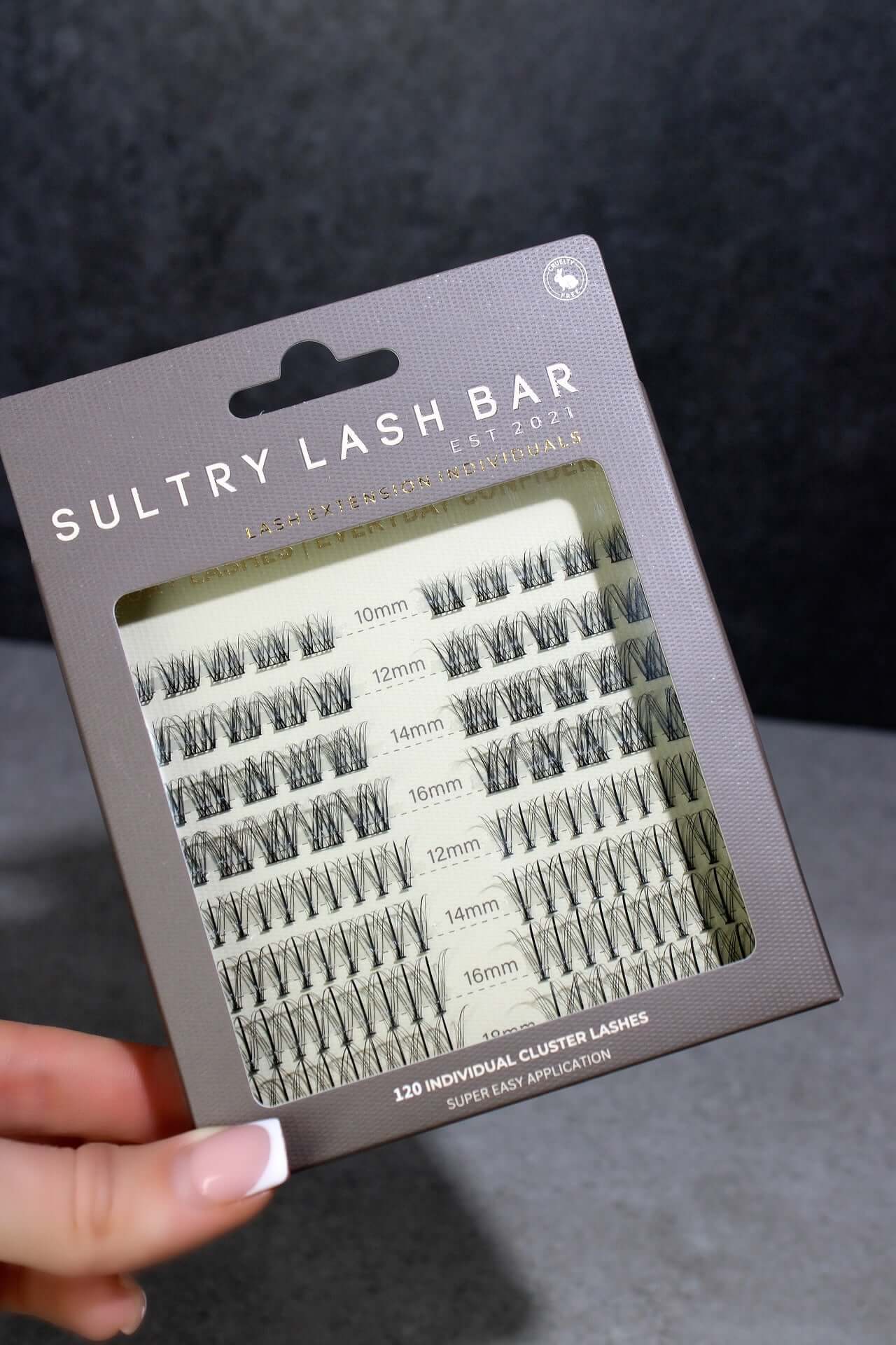 SL26 cluster lashes box showcasing individual lash extensions in various lengths for a natural look.